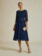 Vestido midi con encaje y manga tres cuartos