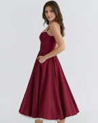 Vestido midi con corsé y falda amplia