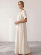 Vestido midi fluido con lazada al cuello